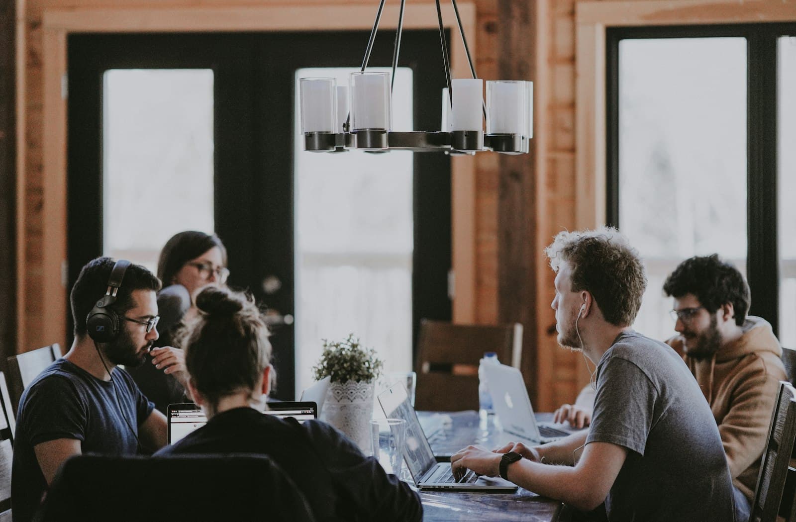 A small team working together around a wooden table